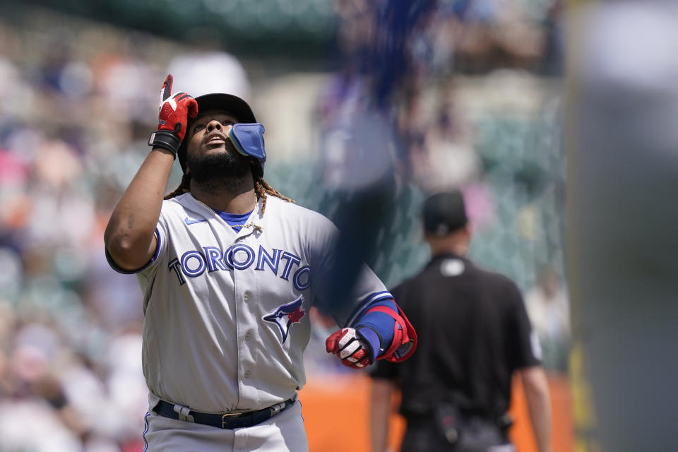 Toronto Blue Jays' Vladimir Guerrero Jr. looks skyward as he crosses home plate after his two-run home run during the fourth inning of a baseball game Detroit Tigers, Sunday, June 12, 2022, in Detroit. (AP Photo/Carlos Osorio)