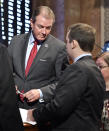 Kentucky Speaker of The House David Osborne, R-Prospect, left, speaks with House Majority Floor Leader Jonathan Shell, R-Lancaster, during the opening of the special session at the Kentucky state Capitol in Frankfort, Ky., Monday, Dec. 17, 2018. Days after losing at the state Supreme Court, Kentucky's Republican governor called the legislature back in session Monday to try again to reshape the state's troubled public pension system. (AP Photo/Timothy D. Easley)