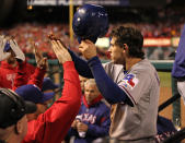 ST LOUIS, MO - OCTOBER 20: Ian Kinsler #5 of the Texas Rangers celebrates in the dugout after scoring to tie the game in the ninth inning during Game Two of the MLB World Series against the St. Louis Cardinals at Busch Stadium on October 20, 2011 in St Louis, Missouri. (Photo by Jamie Squire/Getty Images)