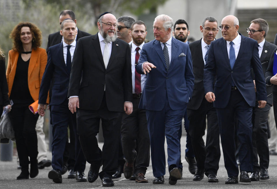 Britain's Prince Charles, center right, and Chief Rabbi Ephraim Mirvis, center left, tour the Israel Museum in Jerusalem, Thursday Jan. 23, 2020. Prince Charles is among dozens of presidents, heads of state and dignitaries who have descended upon the city to attend the largest-ever gathering focused on commemorating the Holocaust and combating modern-day anti-Semitism. (Neil Hall/Pool via AP)