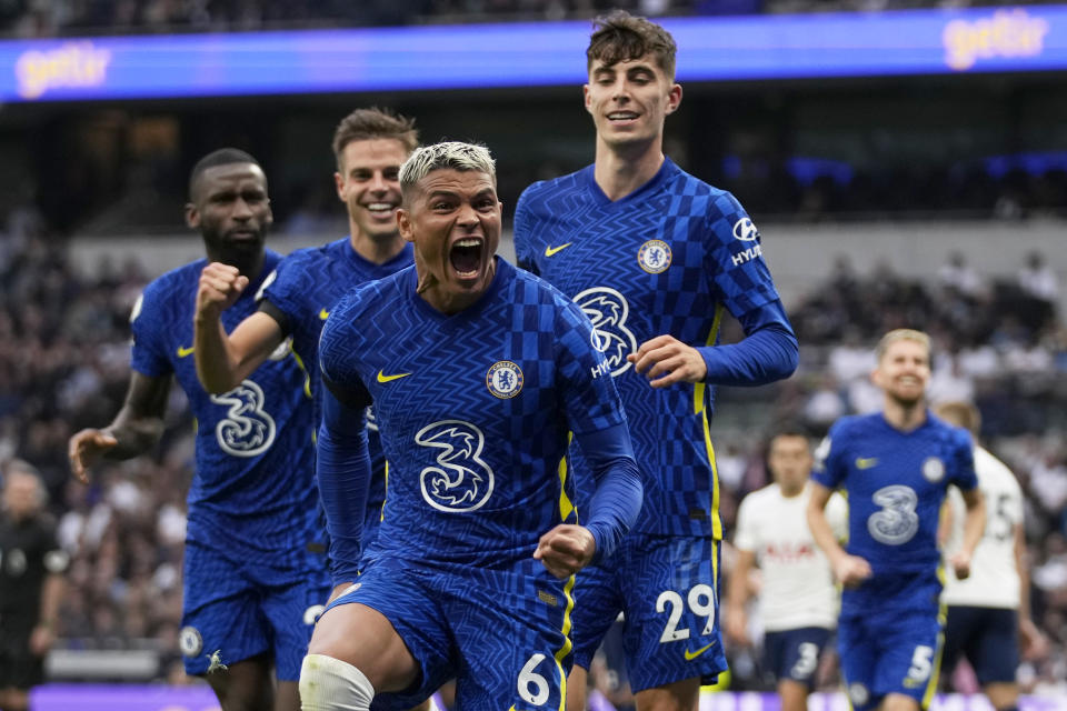 Chelsea's Thiago Silva, center, celebrates after scoring the opening goal during the English Premier League soccer match between Tottenham Hotspur and Chelsea at the Tottenham Hotspur Stadium in London, England, Sunday, Sep. 19, 2021. (AP Photo/Matt Dunham)