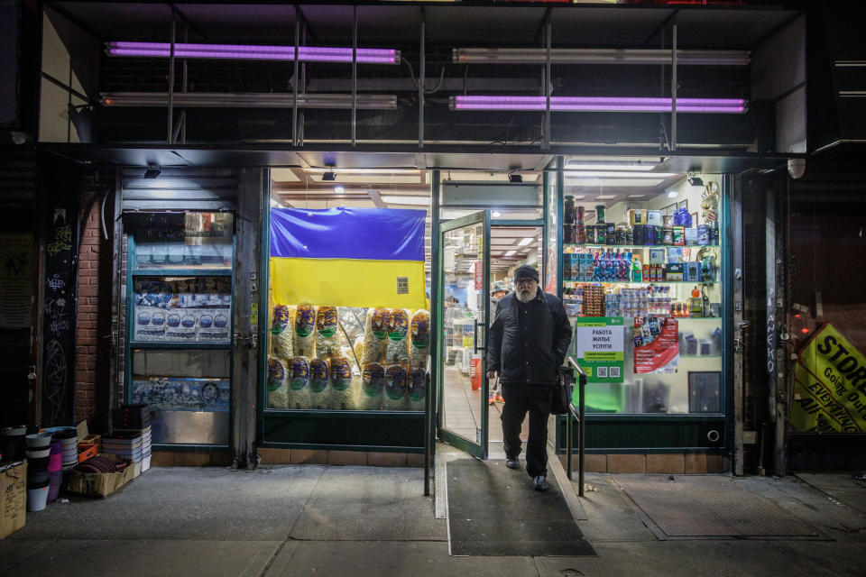 The grocery store Taste of Russia took down its sign and placed a Ukrainian flag in the window. (Julius Constantine Motal / NBC News)