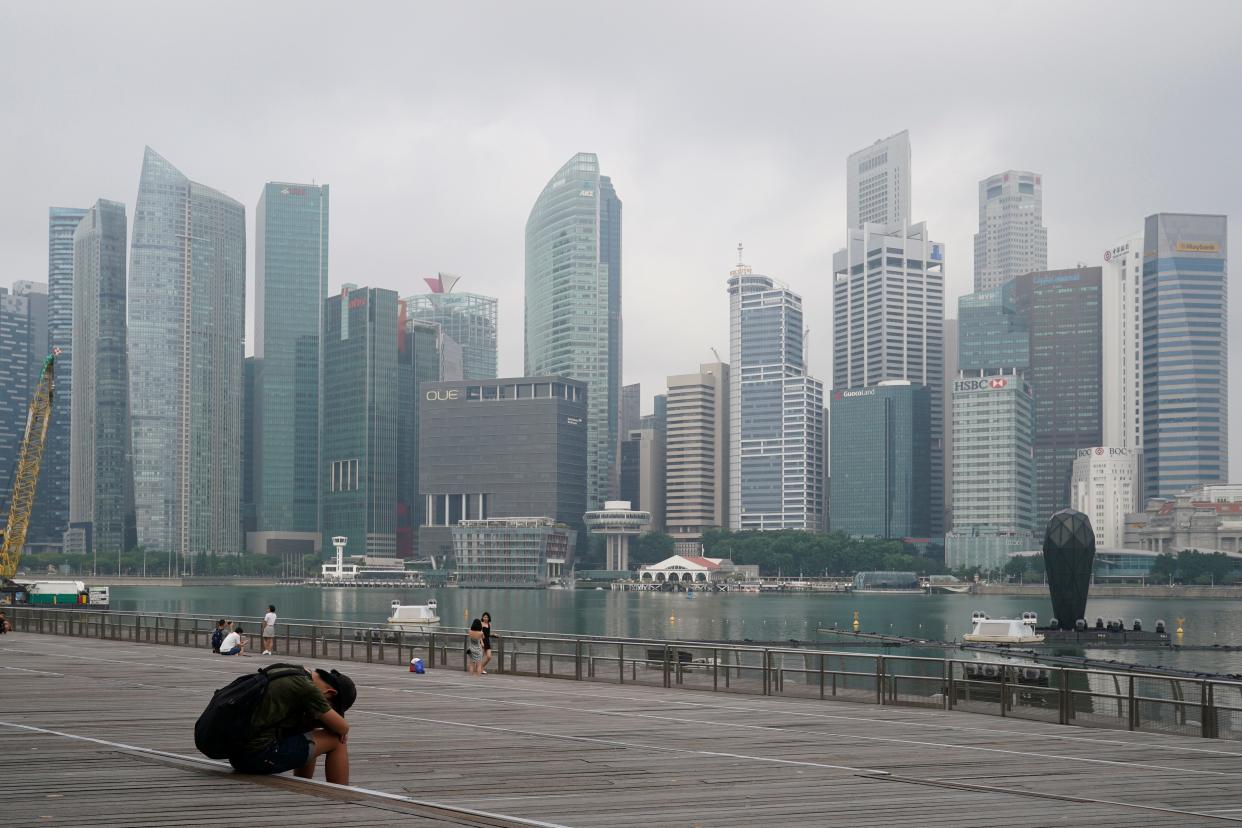 FILE - A man takes a nap as the central business district is shrouded by haze in Singapore, on Sept. 23, 2019. Singapore executed a man Wednesday, July 26, 2023, for drug trafficking and is set to hang a woman Friday — the first in 19 years — prompting renewed calls for a halt to capital punishment.
