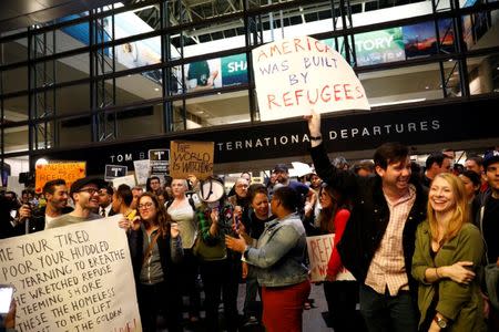 People protest against U.S. President Donald Trump's travel ban on Muslim majority countries at the International terminal at Los Angeles International Airport (LAX) in Los Angeles, California, U.S., January 28, 2017. REUTERS/Patrick T. Fallon