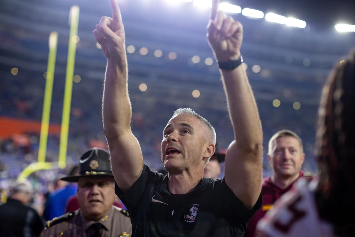 Florida State Seminoles head coach Mike Norvell gestures towards the crowd after the game against the Florida Gators at Steve Spurrier Field at Ben Hill Griffin Stadium in Gainesville, FL on Saturday, November 25, 2023. [Matt Pendleton/Gainesville Sun]