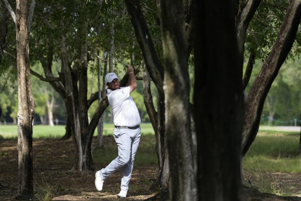 Shane Lowry of Great Britain and Ireland, plays a shot on the second hole during the Fourball matches of the Hero Cup at Abu Dhabi Golf Club, in Abu Dhabi, United Arab Emirates, Friday, Jan. 13, 2023. (AP Photo/Kamran Jebreili)