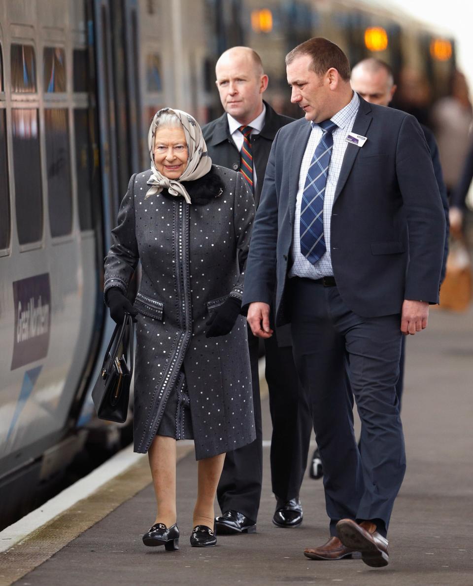 Queen Elizabeth II boards a train at King’s Lynn Station to return to London after her Christmas break at Sandringham House, February 2016.