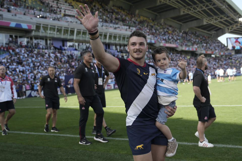 Argentina's Mateo Carreras waves to fans after winning the Rugby World Cup Pool D match between Japan and Argentina at the Stade de la Beaujoire in Nantes, western France, Sunday, Nov. 8, 2023. (AP Photo/Lewis Joly)