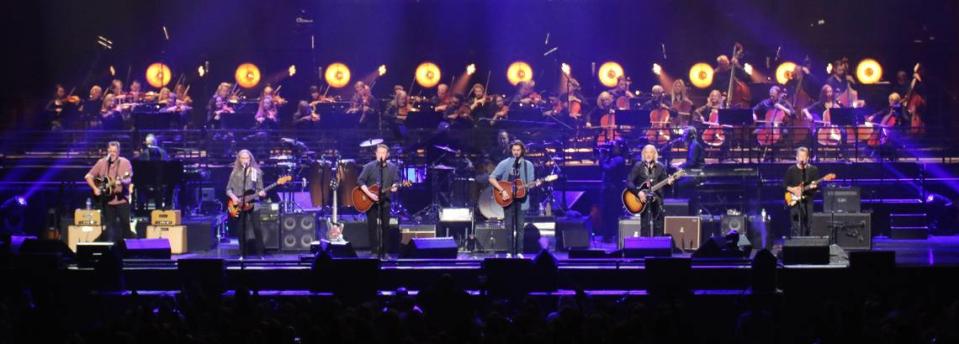 The Eagles line up on stage in concert. The lineup features Vince Gill, Timothy B. Schmit, Don Henley, Deacon Frey and Joe Walsh.