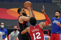 Toronto Raptors guard Fred VanVleet (23) shoots over Philadelphia 76ers forward Tobias Harris (12) during the second half of an NBA basketball game Sunday, Feb. 21, 2021, in Tampa, Fla. (AP Photo/Chris O'Meara)