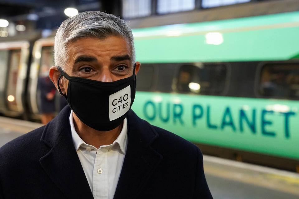 Sadiq Khan boards a train to Glasgow for the Cop 26 summit (PA)