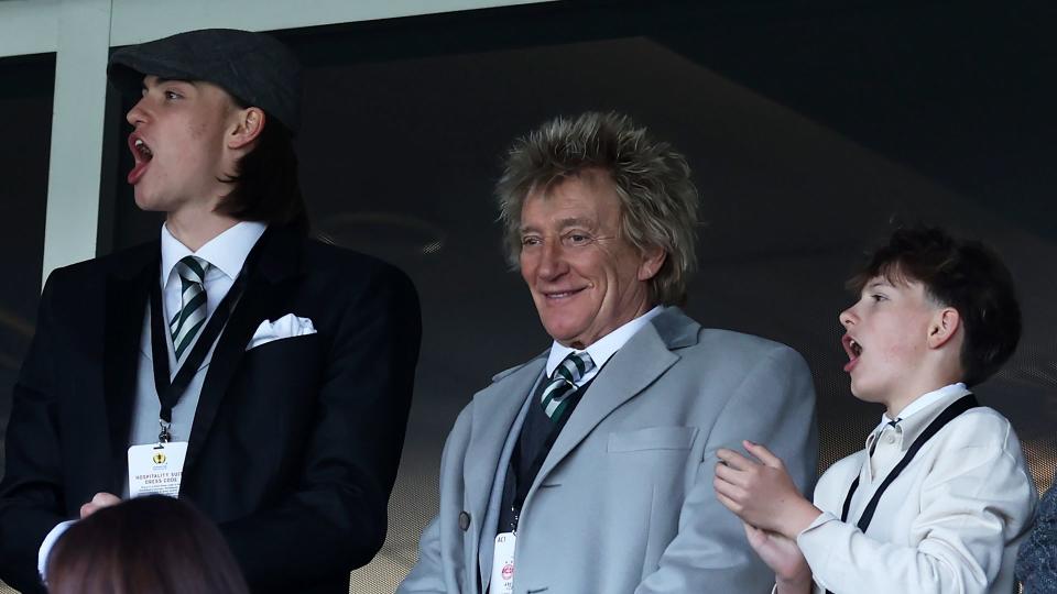 Alastair Stewart, Rod Stewart and Aiden Stewart at a football match, with Alastair and Aiden cheering