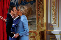 <p>French President Emmanuel Macron kisses wife Brigitte Trogneux during the handover ceremony with the outgoing president in Paris, May 14, 2017. (Photo: Philippe Wojazer/Reuters) </p>