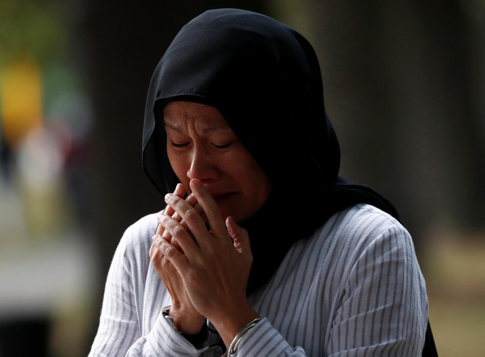 A woman cries at a memorial site for the victims of Friday’s shooting, outside Al Noor mosque in Christchurch, New Zealand (Picture: Reuters)