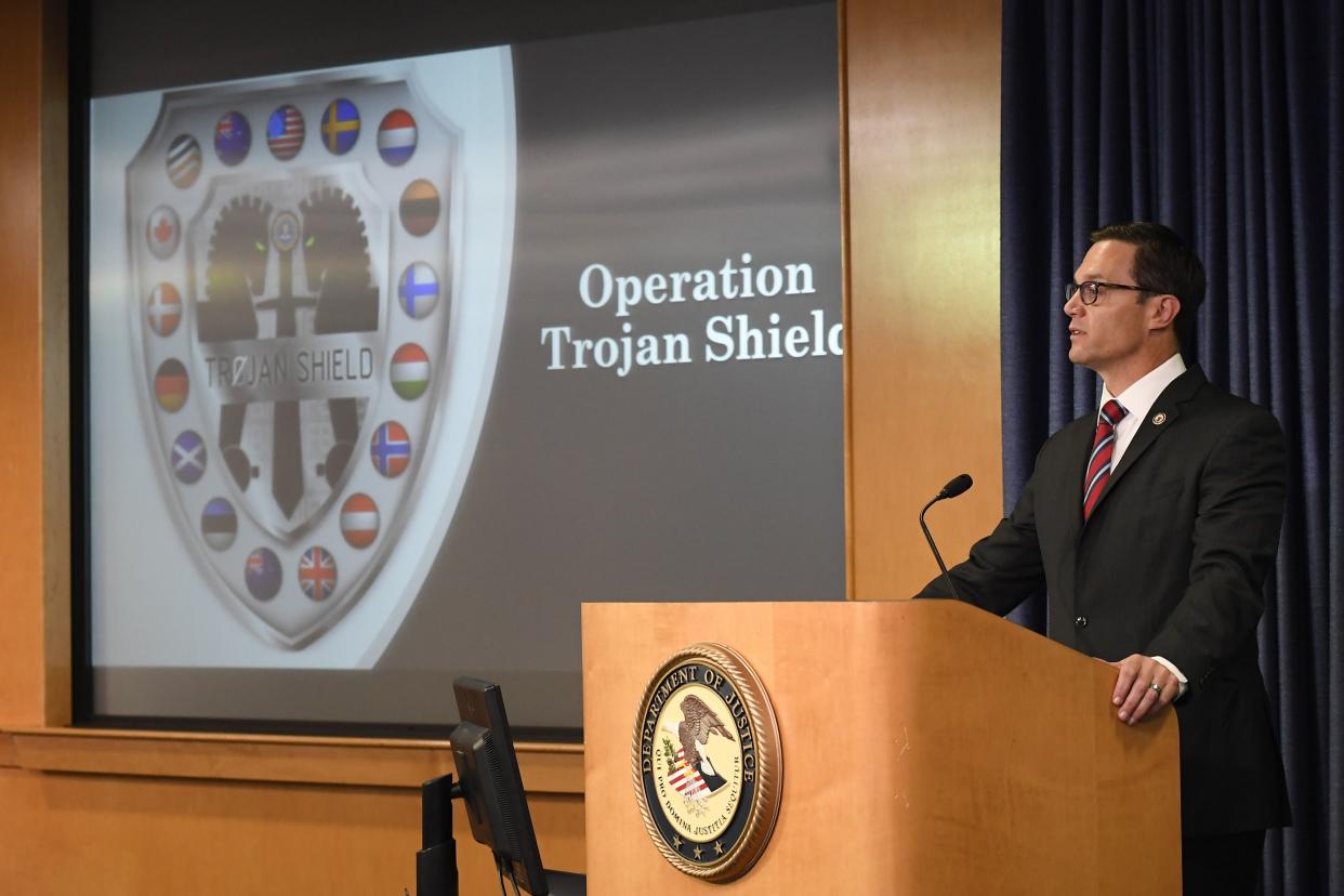 Acting U.S. Attorney Randy Grossman speaks at a news conference announcing Operation Trojan shield, Tuesday, June 8, 2021, in San Diego. The global sting operation involved an encrypted communications platform developed by the FBI and has sparked a series of raids and arrests around the world in which more than 800 suspects were arrested and more than 32 tons of drugs — cocaine, cannabis, amphetamines and methamphetamines were seized. 