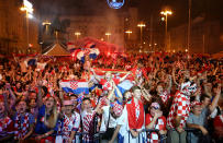 <p>Croatia fans celebrate in Zagreb after the team’s penalty kick win over Russia on Saturday. (Reuters) </p>