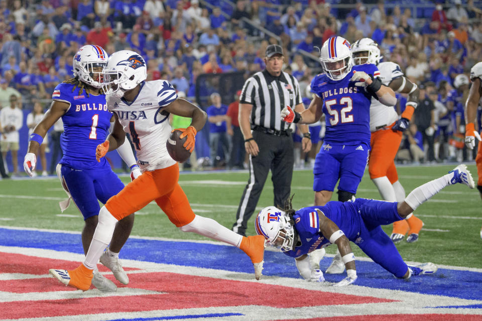 UTSA wide receiver Zakhari Franklin (4) scores a touchdown against Louisiana Tech in the first half of an NCAA college football game in Ruston, La., Saturday, Oct. 23, 2021. (AP Photo/Matthew Hinton)
