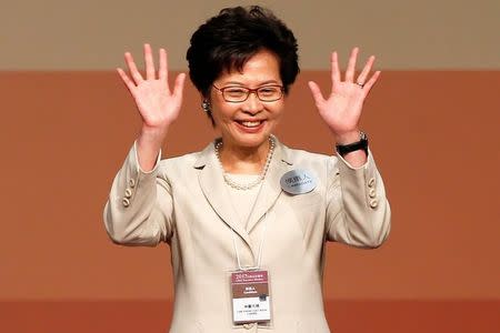 Carrie Lam waves after she won the election for Hong Kong's Chief Executive in Hong Kong, China March 26, 2017. REUTERS/Bobby Yip