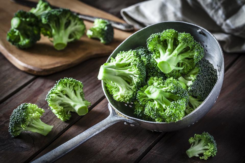 broccoli in an old metal colander