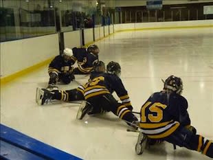 St. Albert pee wee players stretch during a practice — SAMHA.ca