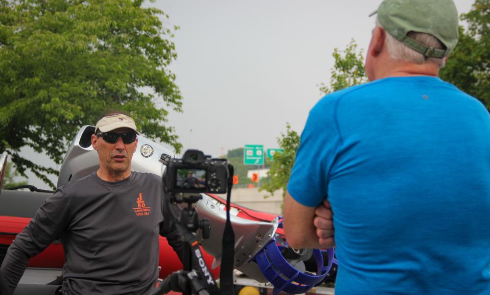 Explore New England host and executive producer Tom Richardson, right, interviews sailing instructor Chris Nardi outside Greater Fall River Re-Creation's sailing center at Heritage State Park on Tuesday, June 6, 2023.