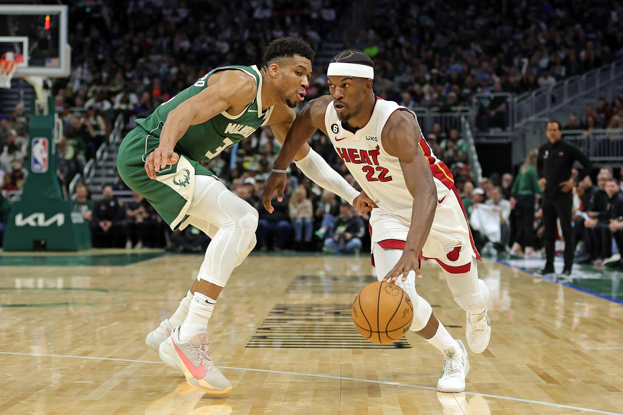 MILWAUKEE, WISCONSIN - APRIL 26: Jimmy Butler #22 of the Miami Heat is defended by Giannis Antetokounmpo #34 of the Milwaukee Bucks during Game 5 of the Eastern Conference First Round Playoffs at Fiserv Forum on April 26, 2023 in Milwaukee, Wisconsin.  The Heat defeated the Bucks in overtime 128-126. NOTE TO USER: User expressly acknowledges and agrees that, by downloading and or using this photograph, User is consenting to the terms and conditions of the Getty Images License Agreement. (Photo by Stacy Revere/Getty Images)