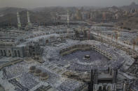 Muslim pilgrims pray at the Grand Mosque, ahead of the annual Hajj pilgrimage in the Muslim holy city of Mecca, Saudi Arabia, Friday, Aug. 17, 2018. The annual Islamic pilgrimage draws millions of visitors each year, making it the largest yearly gathering of people in the world. (AP Photo/Dar Yasin)