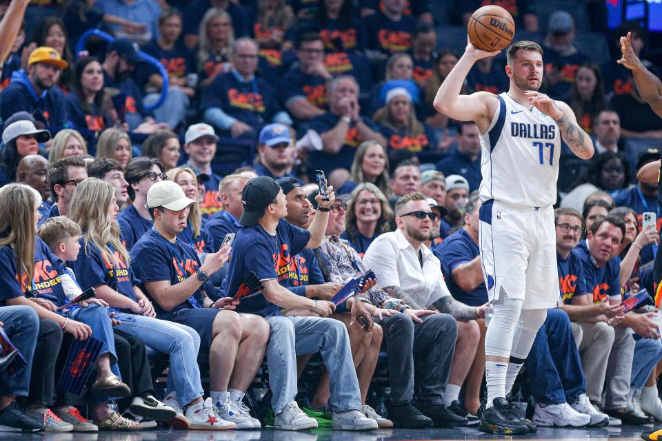 Fans take photos of Dallas guard Luka Doncic (77) in the first quarter during Game 5 of the Western Conference semifinals between the Oklahoma Thunder and the Dallas Mavericks at the Paycom Center in Oklahoma City, on Wednesday, May 15, 2024.