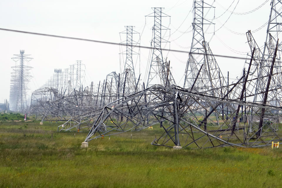 Down power lines are shown in the aftermath of a severe thunderstorm Friday, May 17, 2024, in Cypress, Texas, near Houston. Thunderstorms pummeled southeastern Texas on Thursday killing at least four people, blowing out windows in high-rise buildings and knocking out power to more than 900,000 homes and businesses in the Houston area. (AP Photo/David J. Phillip)