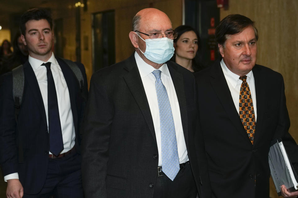 Trump Organization's former Chief Financial Officer Allen Weisselberg, center, arrives to the courtroom in New York, Tuesday, Nov. 15, 2022. (AP Photo/Seth Wenig)