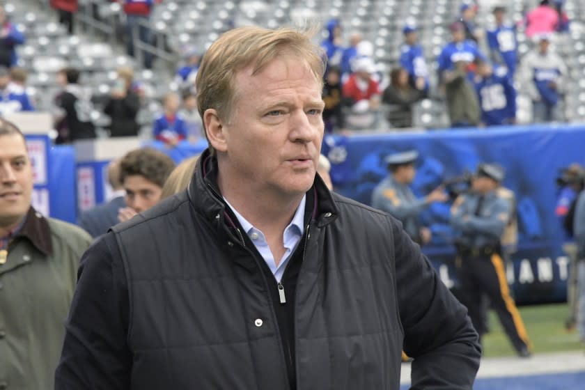 FILE - In this Oct. 20, 2019, file photo, NFL Commissioner Roger Goodell walks on the field before an NFL football game between the New York Giants and the Arizona Cardinals in East Rutherford, N.J. NFL Goodell reiterated the league's support for players fighting for racial justice and protesting police violence. Citing a police officer shooting Jacob Blake in the back on Aug. 23 in Kenosha, Wisconsin, Goodell said the incident has "brought forth more feelings of anger, frustration, anguish, fear for many of us in the NFL family." The investigation into the police shooting of Blake, who is Black, is ongoing. (AP Photo/Bill Kostroun, File)