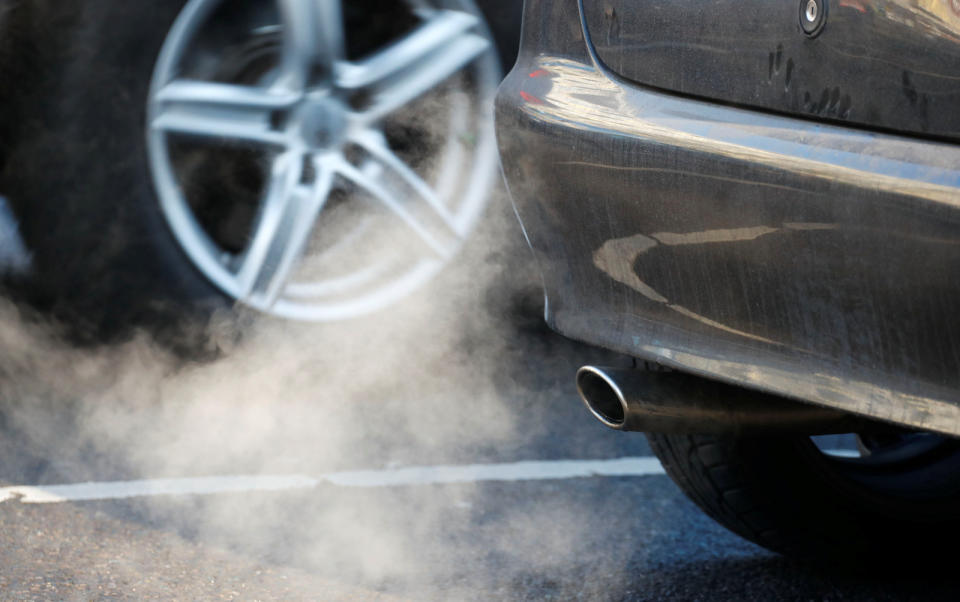 An exhaust pipe of a car is pictured on a street in a Berlin, Germany, February 22, 2018.  REUTERS/Fabrizio Bensch - RC165414BFA0