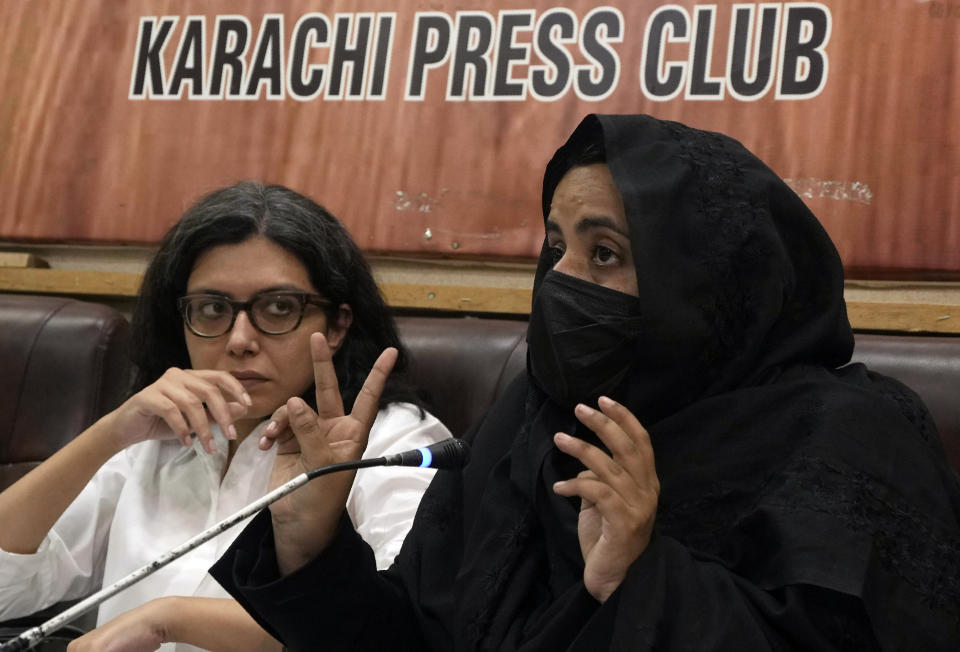 Human rights lawyer Moniza Kakar, right, speaks during a news conference at Karachi Press Club, in Karachi, Pakistan, Saturday, Nov. 11, 2023. Kakar said police in Sindh launch midnight raids on people's homes and detain Afghan families, including women and children. (AP Photo/Fareed Khan)