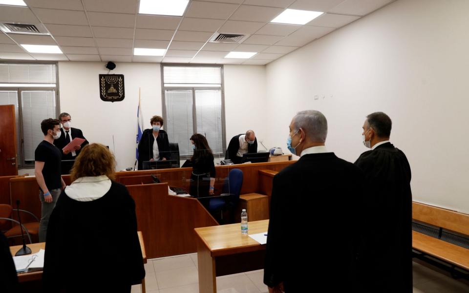  Israeli Prime Minister Benjamin Netanyahu stands at the trial   - RONEN ZVULUN/POOL/EPA-EFE/Shutterstock/Shutterstock 