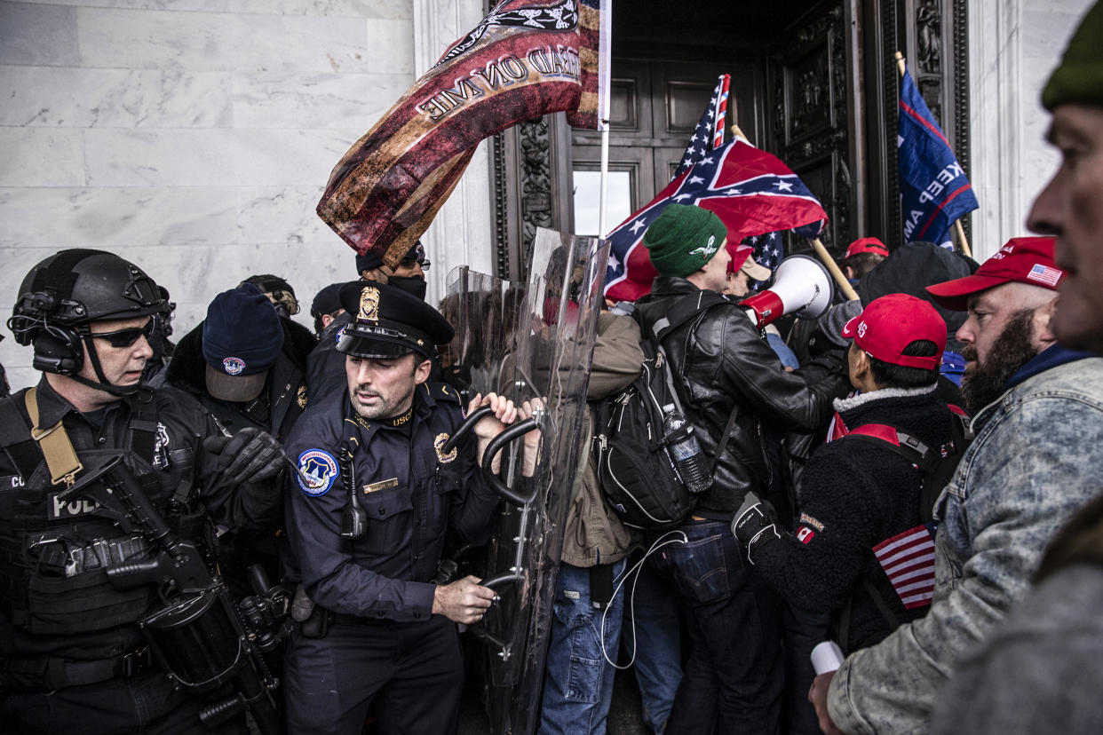 Demonstrators clash with U.S. Capitol police officers while trying to enter the Capitol building during a protest on Jan. 6, 2021. (Victor J. Blue / Bloomberg via Getty Images file)