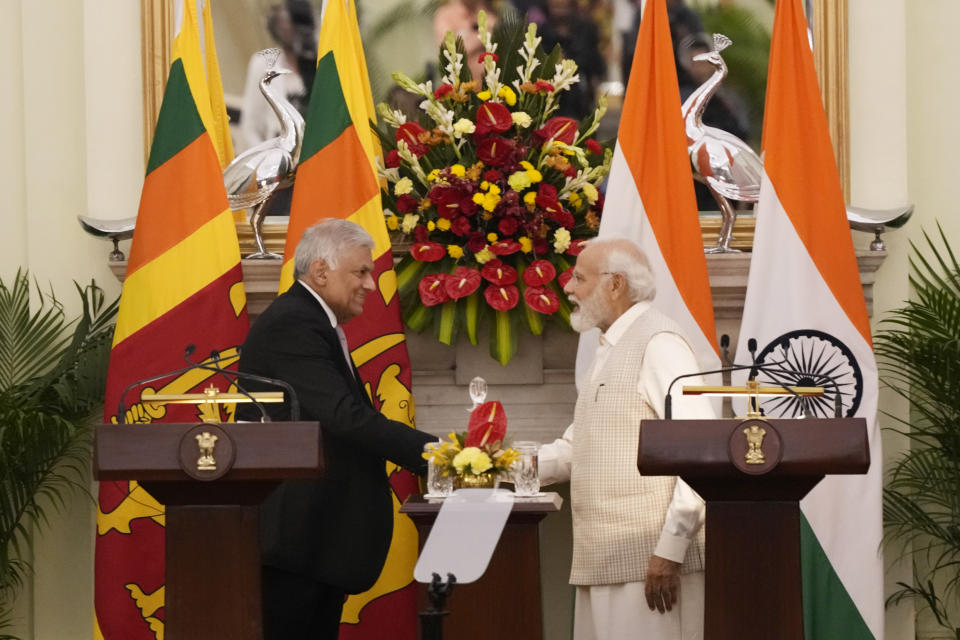 Indian Prime Minister Narendra Modi shakes hand with Sri Lankan President Ranil Wickremesinghe after making press statement respectively, in New Delhi, India, Friday, July 21, 2023. (AP Photo/Manish Swarup)