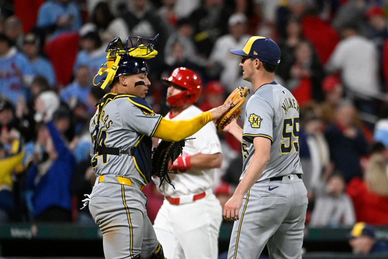 Brewers reliever Hoby Milner is greeted by catcher William Contreras after closing out the Cardinals on Friday night for his first career save.