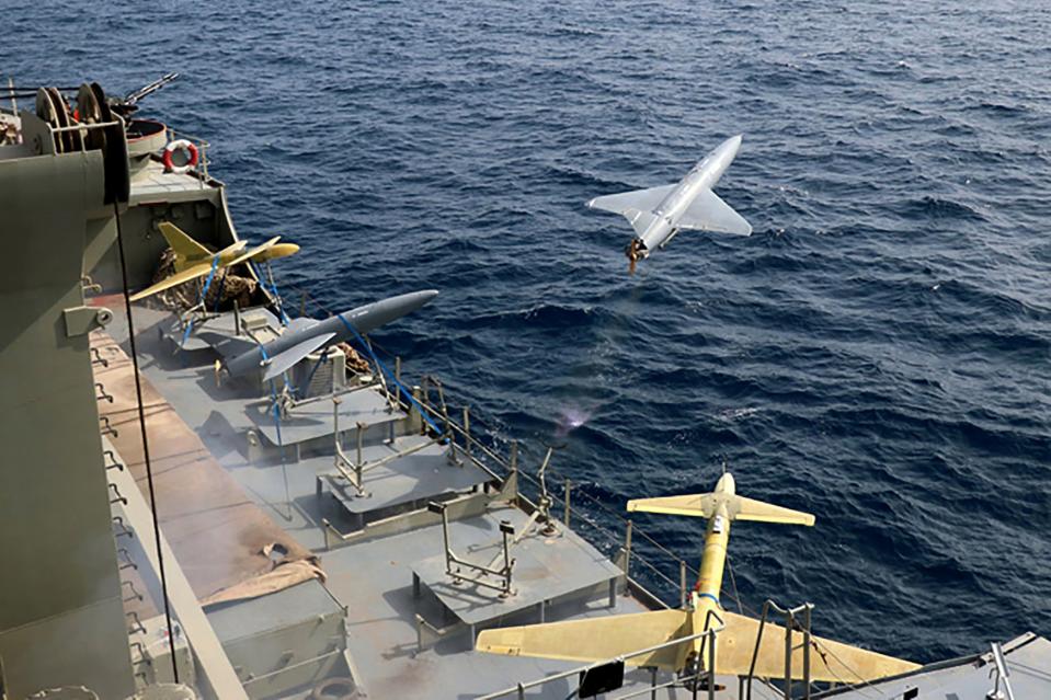 FILE - In this photo released by the Iranian Army on Aug. 25, 2022, a drone is launched from a warship in a military drone drill in Iran. As protests rage at home, Iran's theocratic government is increasingly flexing its military muscle abroad. That includes supplying drones to Russia that now kill Ukrainian civilians, running drills in a border region with Azerbaijan and bombing Kurdish positions in Iraq. (Iranian Army via AP, File)