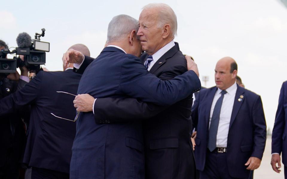 President Joe Biden embraces Israeli Prime Minister Benjamin Netanyahu after arriving at Ben Gurion International Airport