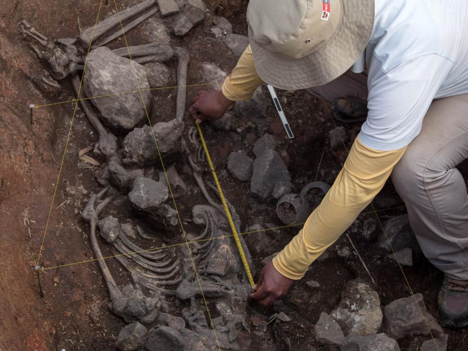 An archaeologist of the Pacopampa Archaeological Project works on the site of a 3,000-year-old tomb which they believe might have honored an elite religious leader in the Andean country some three millennia ago, in Pacopampa, Peru August 25, 2023.