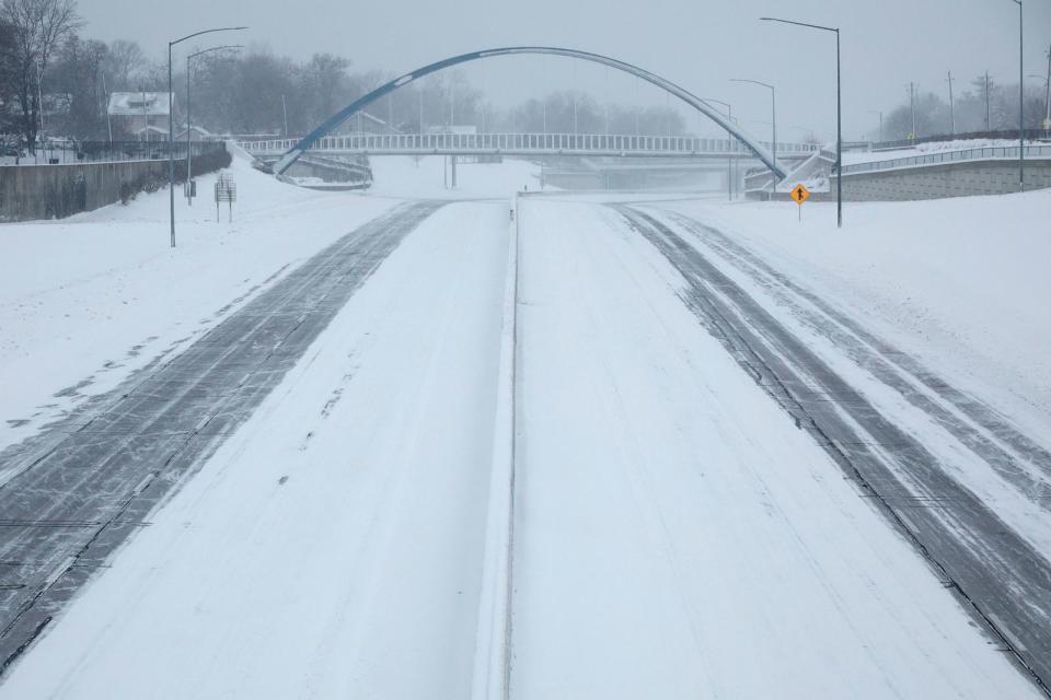 PHOTO: Single tracks move east and west on the Interstate 235 John MacVicar Freeway as winter storm Gerri dumps inches of snow with high winds on Jan. 12, 2024 in Des Moines, Iowa. (Chip Somodevilla/Getty Images)