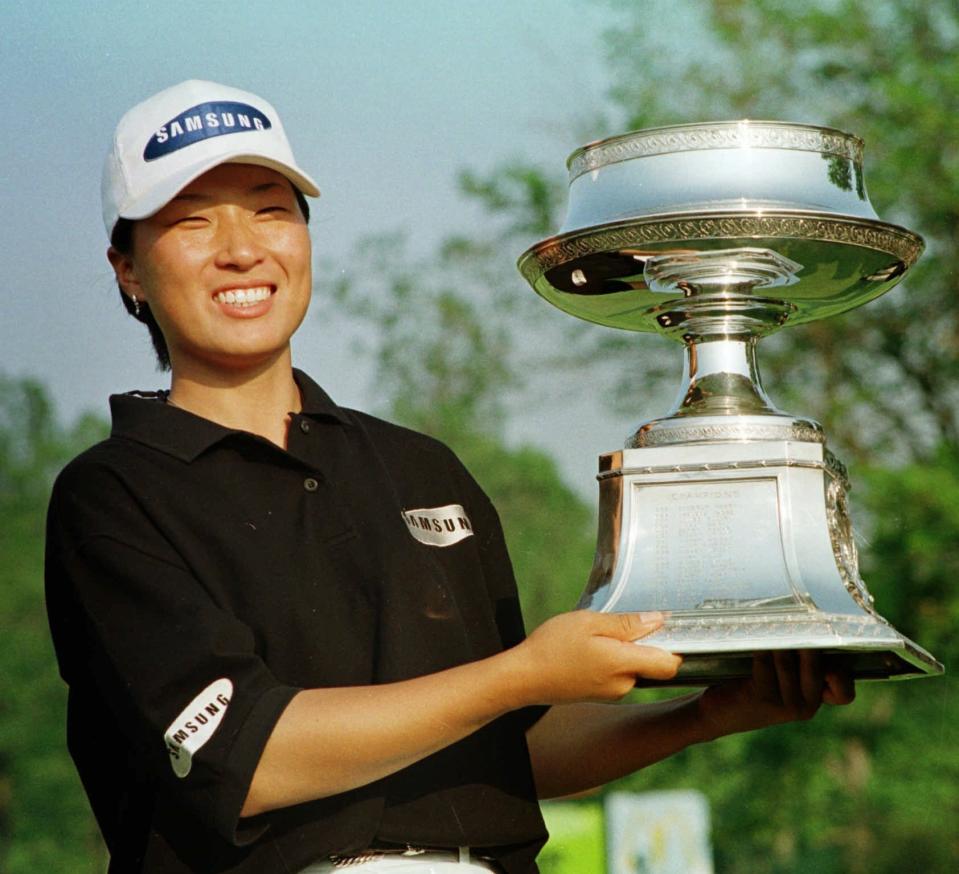 FILE - In this May 17, 1998, file photo, Se Ri Pak of South Korea poses with her trophy after winning the LPGA McDonald's Championship at the DuPont Country Club in Rockland, Del. It was 22 years ago this week that Pak burst onto the LPGA scene with her first major. (AP Photo/George Widman, File)