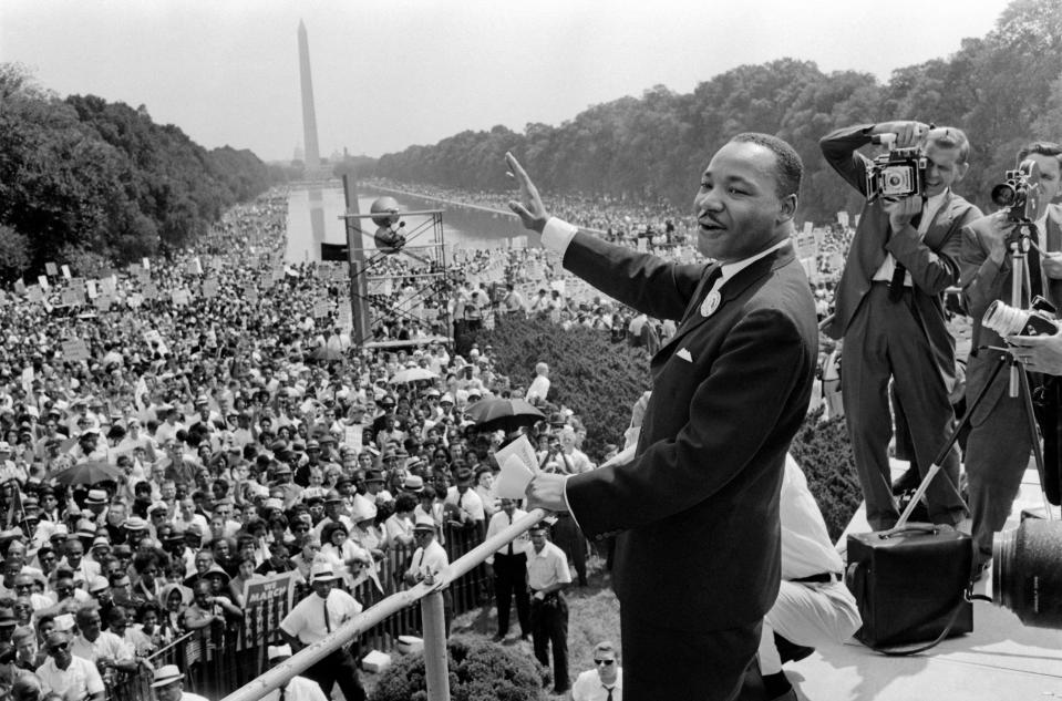 The civil rights leader Martin Luther King waves to supporters August 28, 1963, on the Mall in Washington, DC, during the "March on Washington."