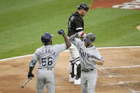Tampa Bay Rays' Brandon Lowe, right, celebrates his home run off Chicago White Sox starting pitcher Lance Lynn with Randy Arozarena during the third inning of a baseball game Monday, June 14, 2021, in Chicago. (AP Photo/Charles Rex Arbogast)