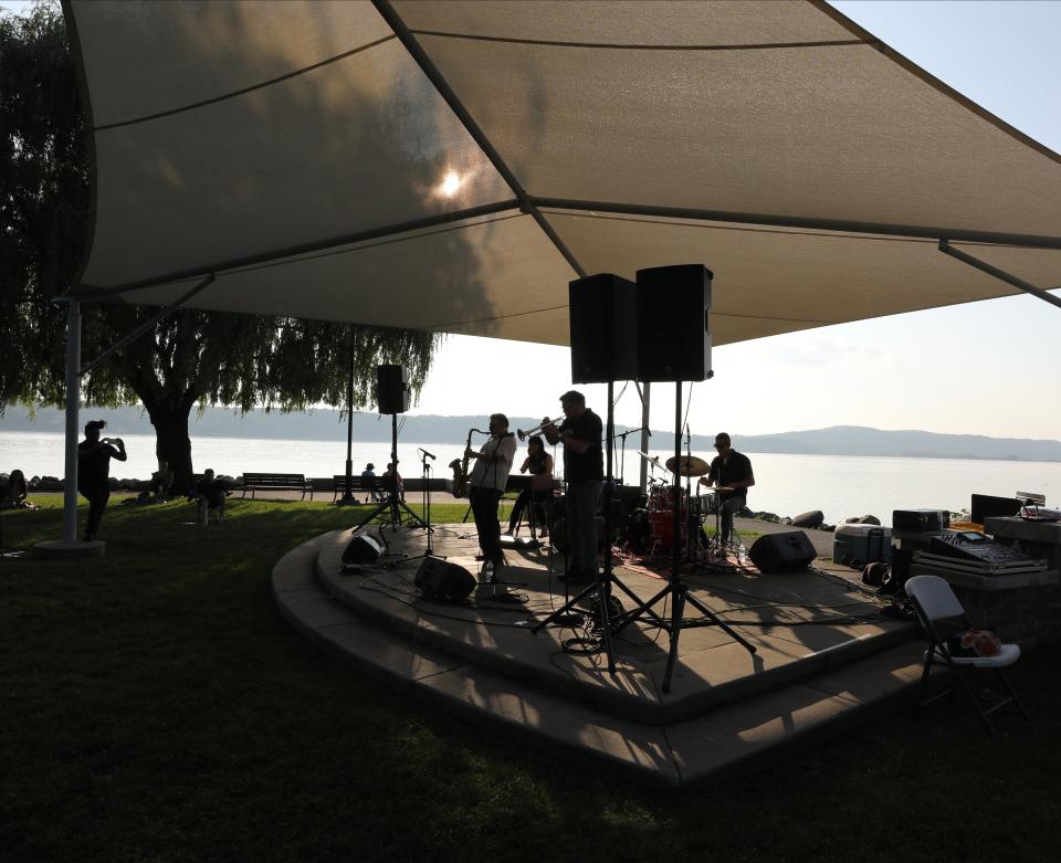 The Akiko Tsuruga Organ Quartet perform on the stage at the Waterfront Park in Dobbs Ferry, July 5, 2023. The Jazz Forum Arts 23rd Annual Dobbs Ferry Music Series is a popular music venue on the Hudson River, that attracts music lovers from all parts of the region. Jazz Forum Arts presents 32 weeknight evening concerts at 5 Hudson River Parks in Westchester County. Other members of the band in close Jerry Weldon tenor saxophone, Joe Magnarelli on trumpet and Jason Tiemann on drums. 