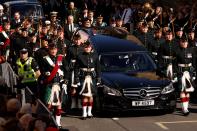 <p>Britain's King Charles III, flanked by Britain's Princess Anne, Princess Royal, Britain's Prince Andrew, Duke of York and Britain's Prince Edward, Earl of Wessex walk behind the procession of Queen Elizabeth II's coffin, from the Palace of Holyroodhouse to St Giles Cathedral, on the Royal Mile on September 12, 2022, where Queen Elizabeth II will lie at rest. - Mourners will on Monday get the first opportunity to pay respects before the coffin of Queen Elizabeth II, as it lies in an Edinburgh cathedral where King Charles III will preside over a vigil. (Photo by ODD ANDERSEN/POOL/AFP via Getty Images)</p> 