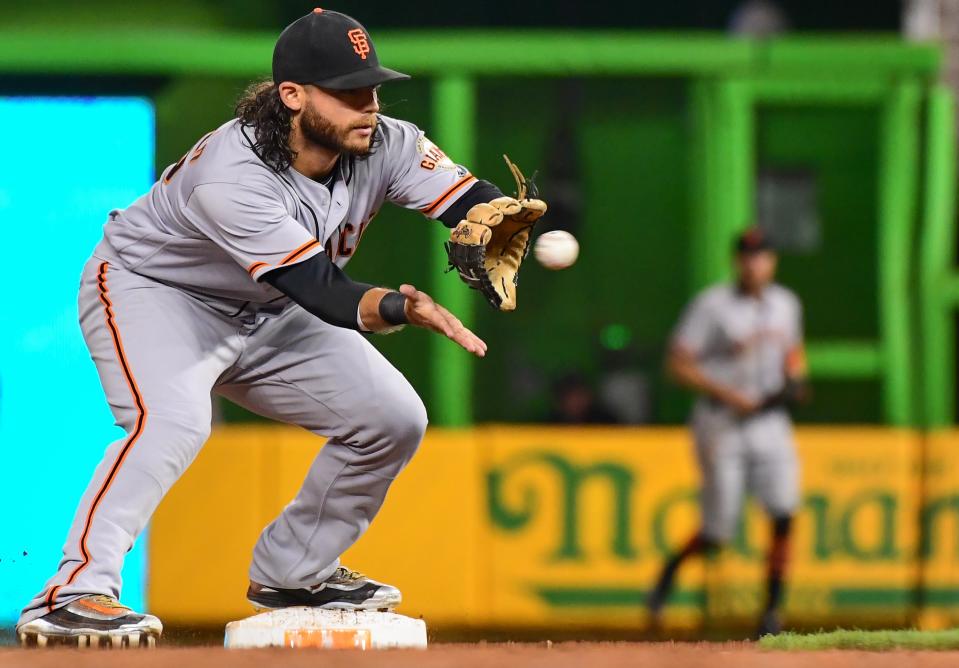 Brandon Crawford unleashed a less-than-accurate throw during batting practice on Thursday. (Getty Images)