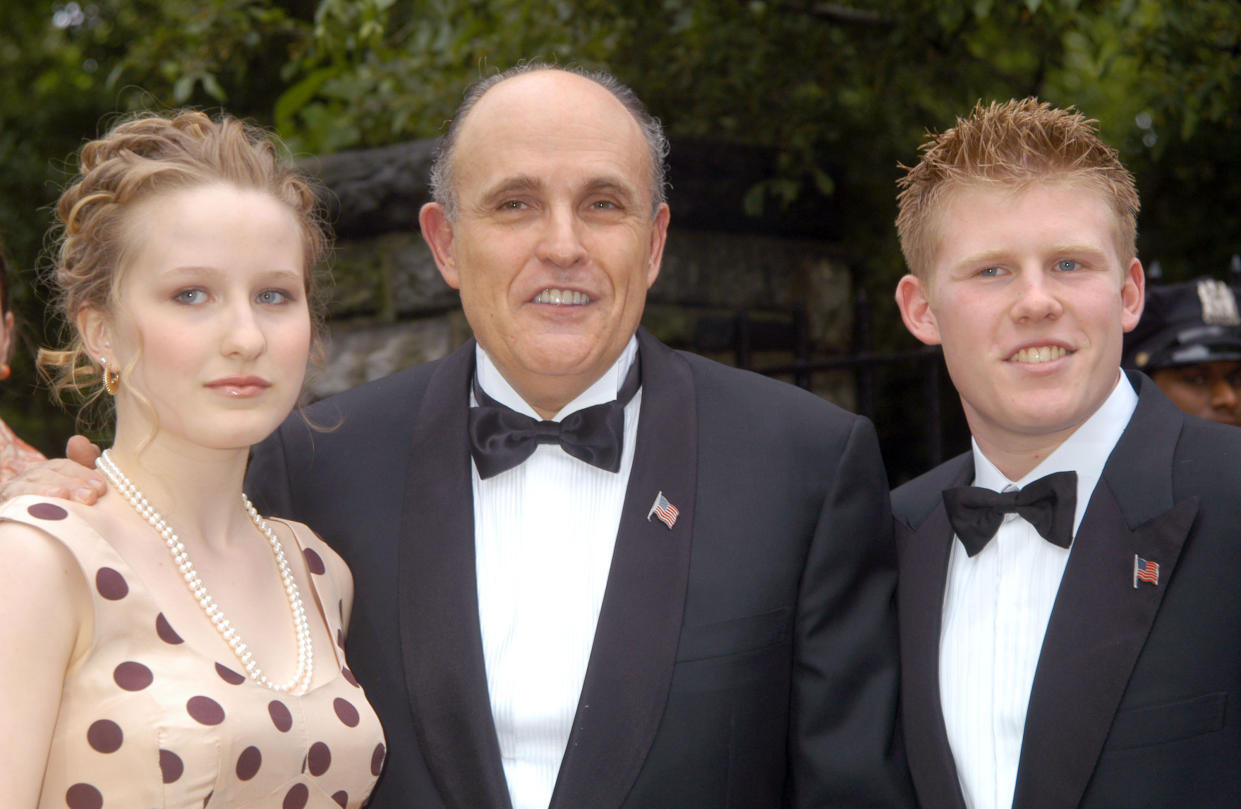 Caroline Rose Giuliani with her father, Rudy Giuliani, and brother, Andrew at the 2003 wedding of Rudy and Judi Nathan. In a Vanity Fair essay published this week, Caroline wrote of her father, "We are multiverses apart, politically and otherwise." (Photo: Carmen Valdes/Ron Galella Collection via Getty Images)