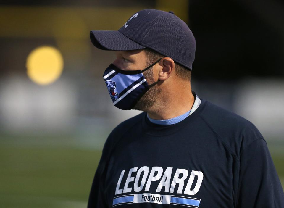 Louisville High School head football coach Troy Davis watches from the sideline as his team plays Notre Dame-Cathedral Latin in an OHSAA first-round playoff game; Friday, Oct. 9, 2020.