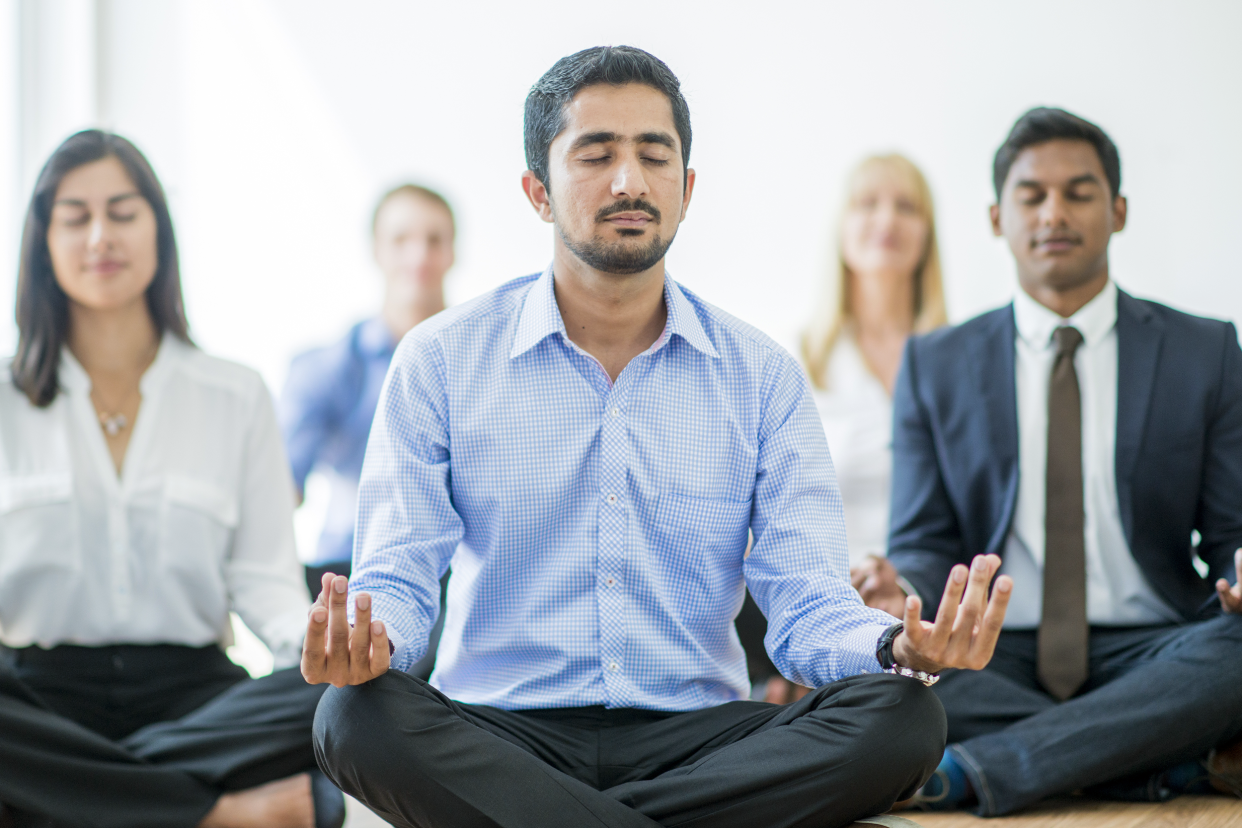Employees meditating